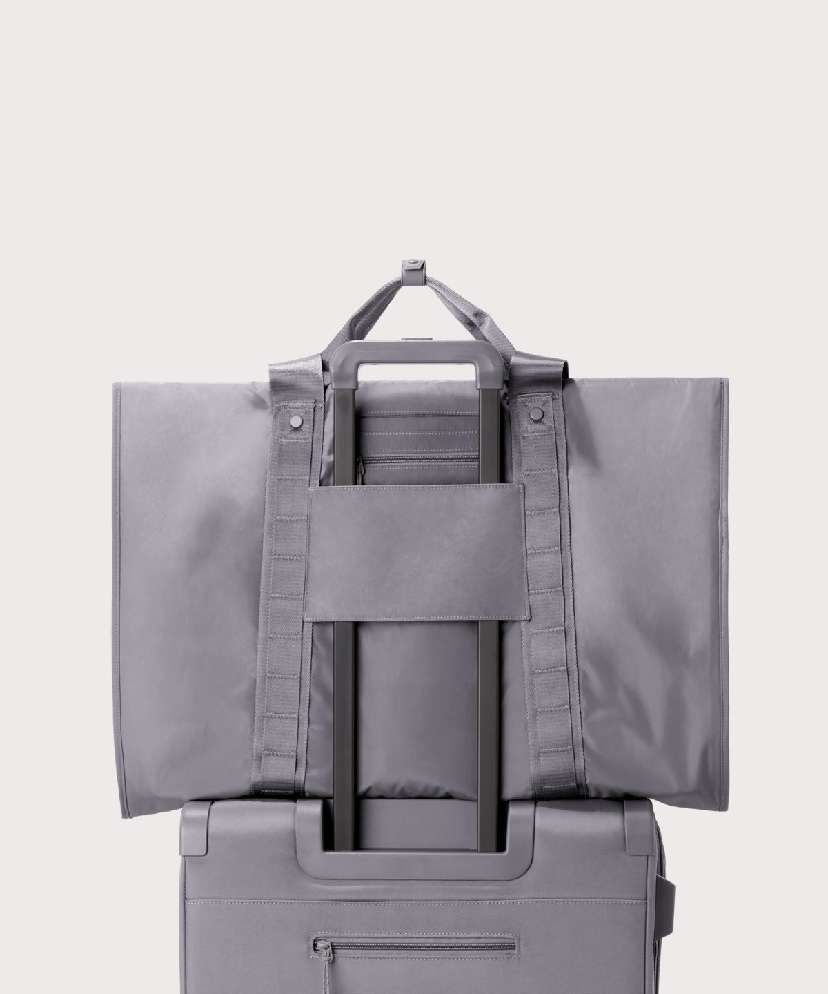 Back view of Capri garment bag in ash on luggage handle